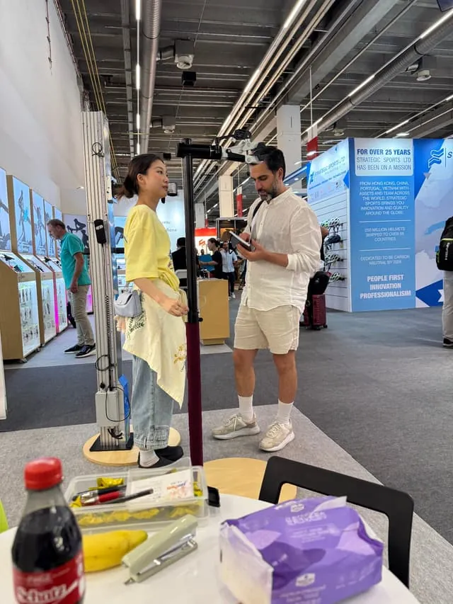 Visitor trying wheel truing stand at Eurobike 2025, Frankfurt